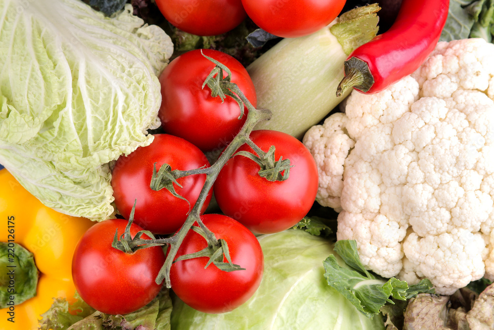 Fresh vegetables including lettuce cucumber cabbage onion pepper beetroot carrot zucchini and tomatoes. Vegetable background. close-up Fresh vegetables including lettuce cucumber cabbage onion pepper beetroot carrot zucchini and tomatoes. Vegetable background. close-up