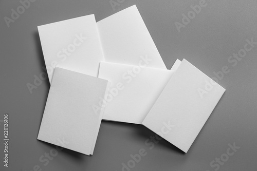 Blank portrait mock-up paper. brochure magazine isolated on gray, changeable background / white paper isolated on gray