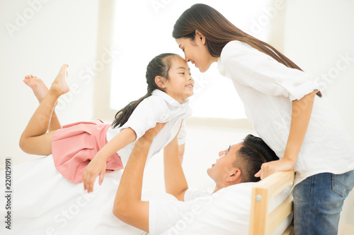 Happy loving family. mother and child girl playing, kissing and hugging