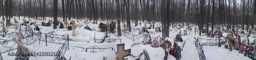 type of cemetery in winter with wooden crosses photo