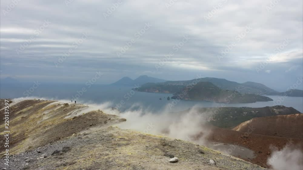Hikers on the Vulcano crater and view of Aeolian archipelago, Sicily Hikers on the Vulcano crater and view of Aeolian archipelago, Sicily
