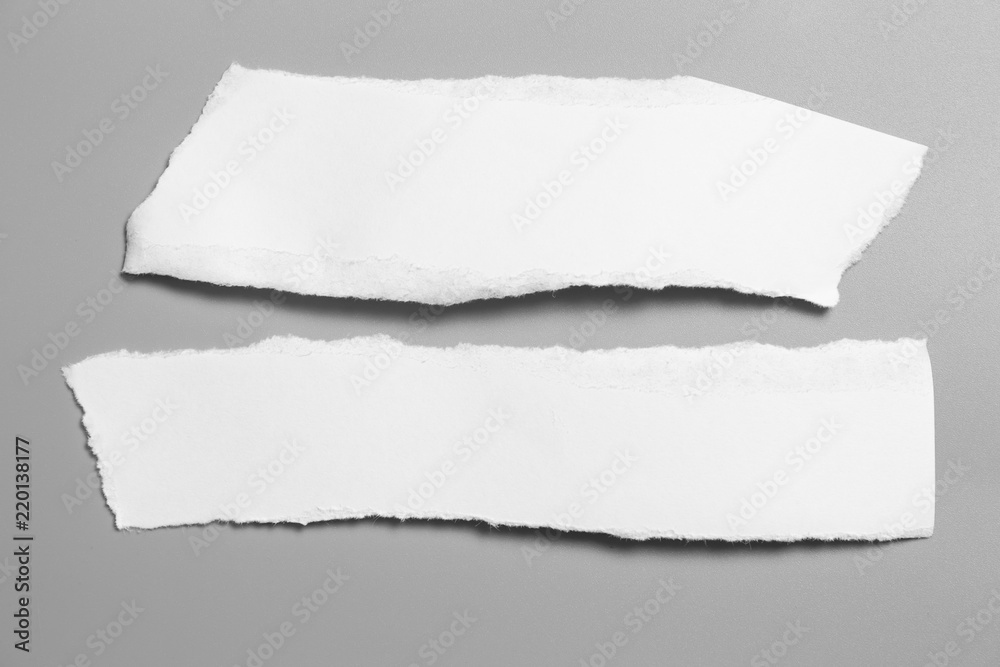 white torn paper on gray background. collection paper rip