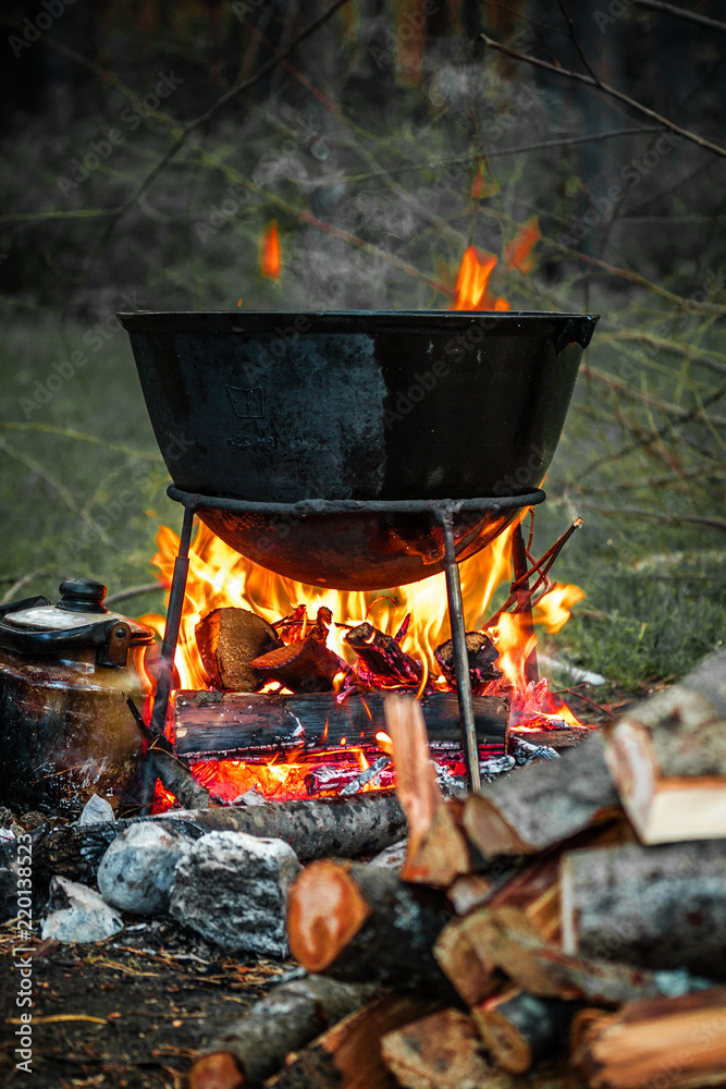 a cauldron for cooking is on the fire a cauldron for cooking is on the fire