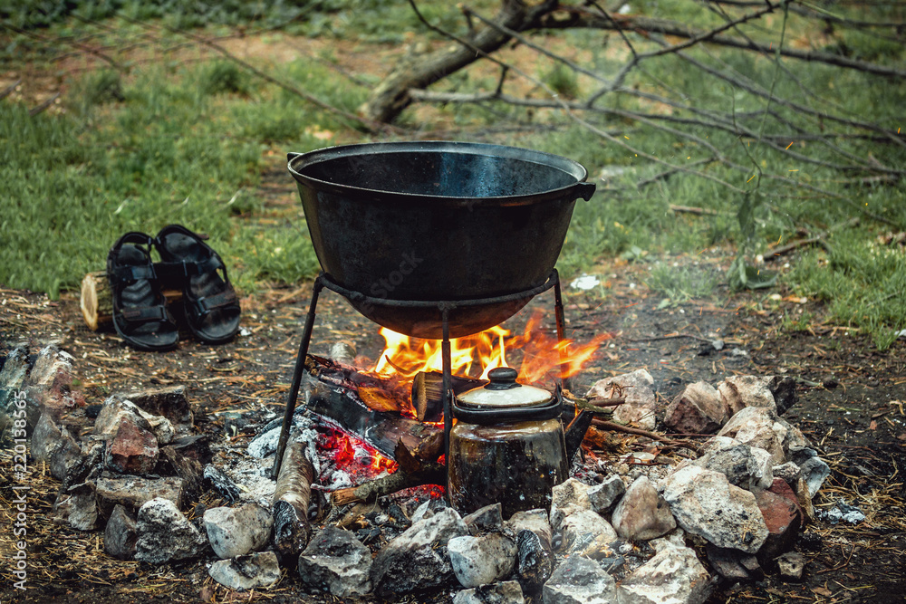 a cauldron for cooking is on the fire a cauldron for cooking is on the fire