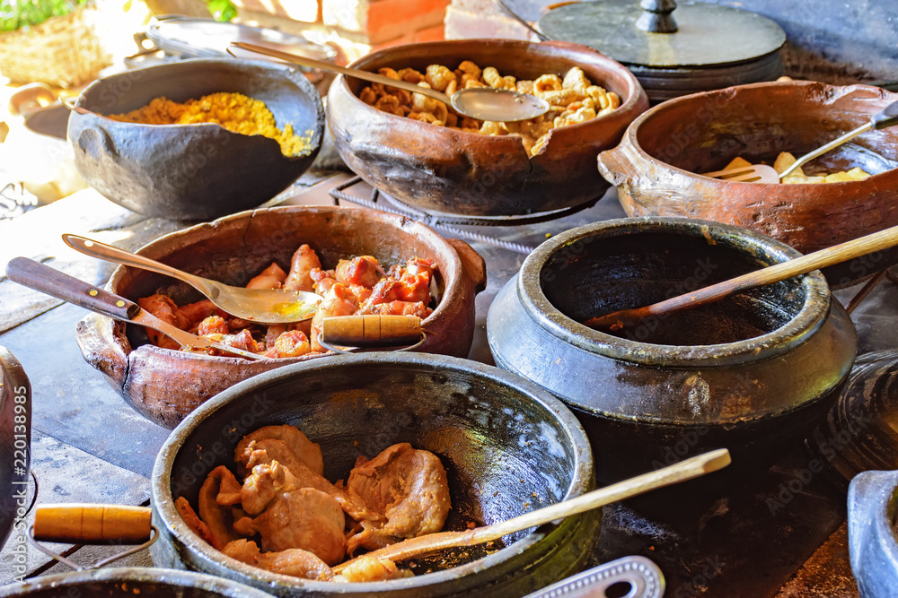 Traditional Brazilian food being prepared in clay pots and in the old and  popular wood stove Stock Photo | Adobe Stock