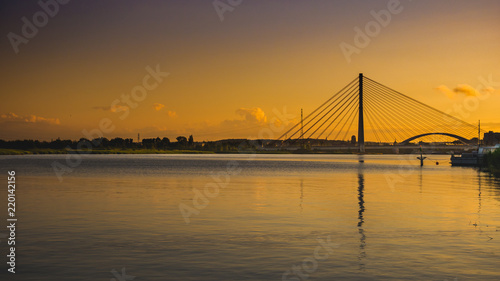 Suspension bridge over the Martwa Wisla in Gdansk at sunset © Kamil