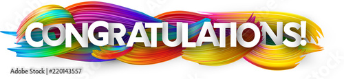Congratulations paper banner with colorful brush strokes.