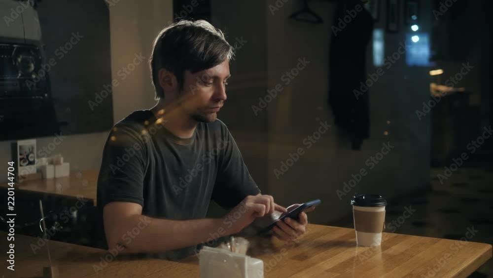 Young man think and strain checking email on smartphone , Think hard business man accountant, tired young freelancer man with smartphone Young man think and strain checking email on smartphone , Think hard business man accountant, tired young freelancer man with smartphone
