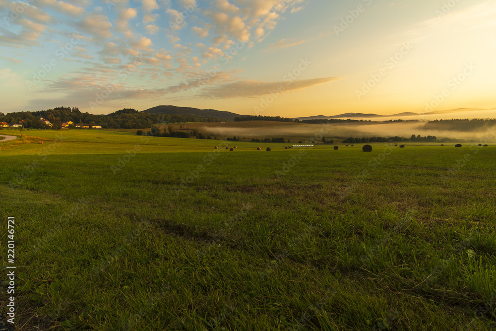 Summer landscape while sunrise in the Czech Republic near the National park of Sumava.
