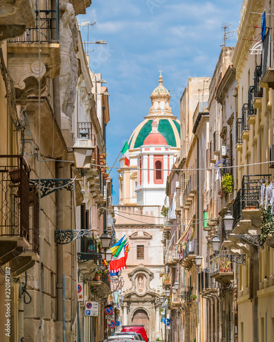 Scenic sight in Trapani with the Church of Saint Francis of Assisi in the background. Sicily, Italy.