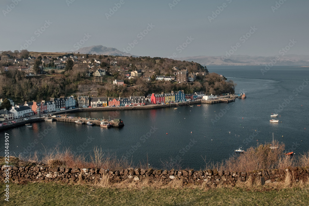 Aeial view in morning light of Tobermory Bay on the Isle of Mull. Scotland mainland highland peaks in the background, Wednesday 11 April 2018, Isle of Mull, Scotland