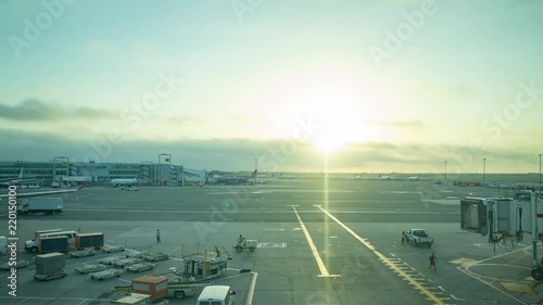 Busy airport at sunrise