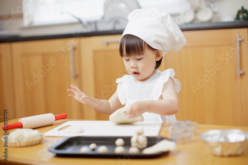 baby girl pretend baking at home