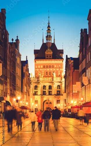 Golden gate in old town at night, Gdansk, Poland, retro toned