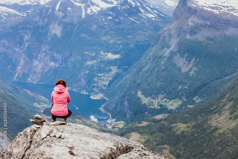 Tourist woman on Dalsnibba viewpoint Norway
