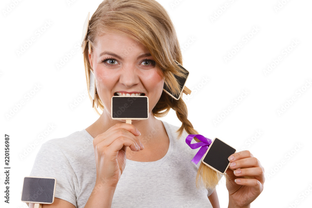 Teenage girl biting little school blackboards Teenage girl biting little school blackboards