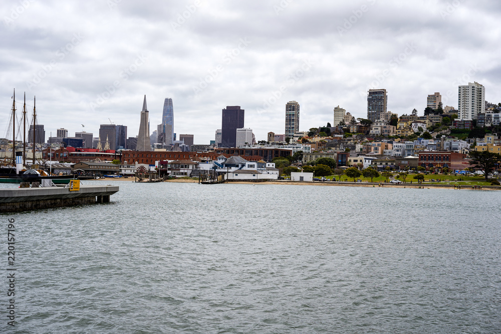 SAN FRANCISCO, CALIFORNIA, USA- MAY 15, 2018: Ships at the quay and view of the city SAN FRANCISCO, CALIFORNIA, USA- MAY 15, 2018: Ships at the quay and view of the city