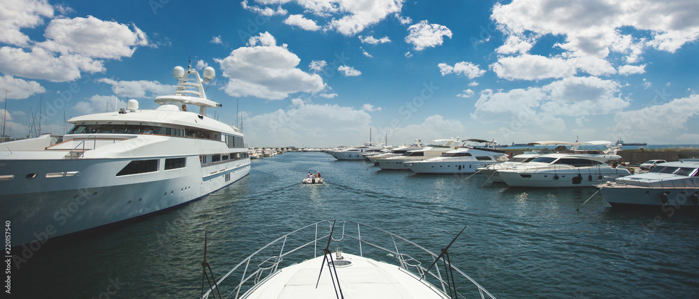 Fototapeta premium Motor yacht on the dock, yacht stern to berth