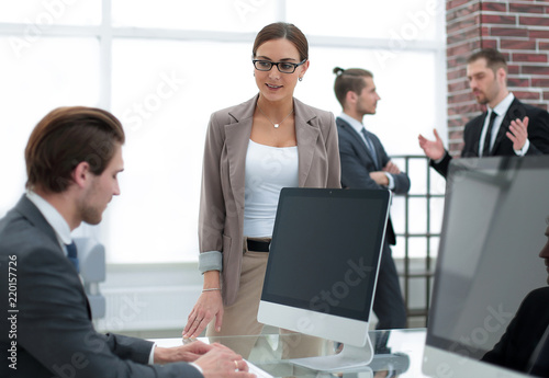 woman Manager standing near the Desk