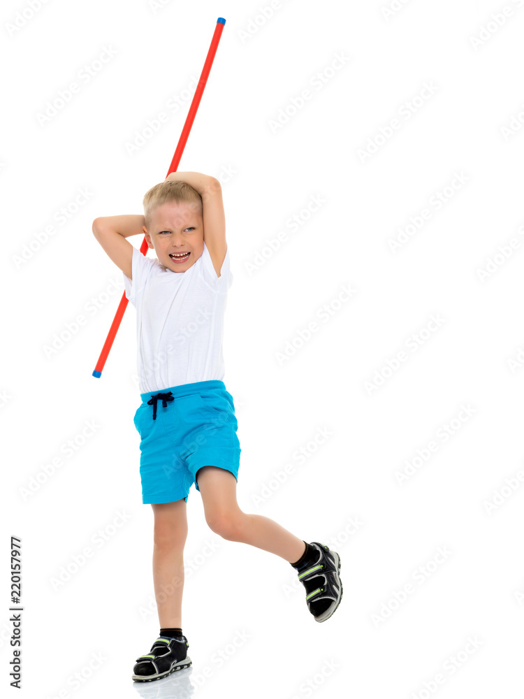 A little boy in a clean white T-shirt is engaged in fitness. A little boy in a clean white T-shirt is engaged in fitness.