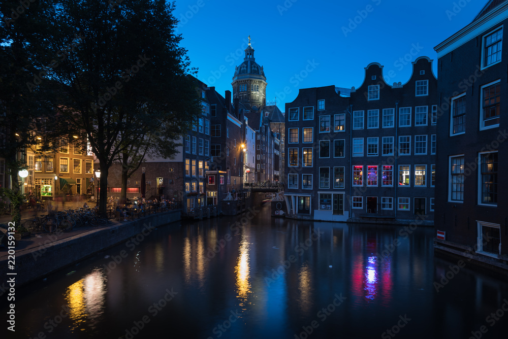 Night colors reflected on the canal water in Amsterdam, The Netherlands