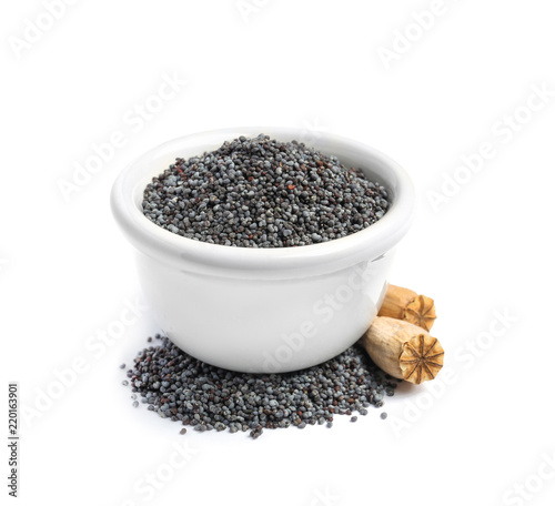 Bowl with poppy seeds on white background