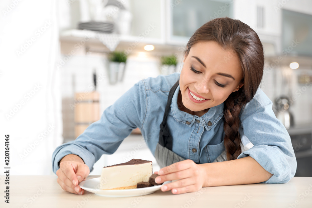 Professional female chef presenting dessert on table in kitchen Professional female chef presenting dessert on table in kitchen