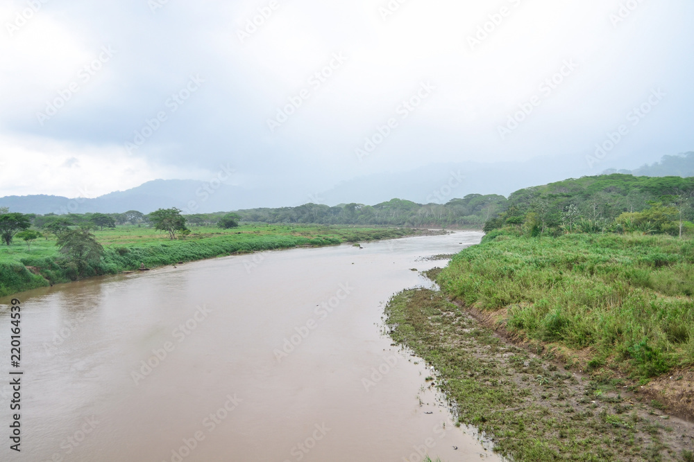 the brown river in the middle of the landscape the brown river in the middle of the landscape