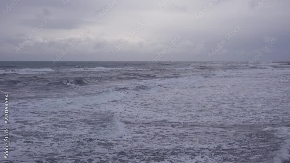 Dark waves roll in on this moody and mystical ocean scene during a storm on the Atlantic. Dark waves roll in on this moody and mystical ocean scene during a storm on the Atlantic.