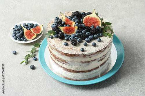 Delicious homemade cake with fresh berries on table