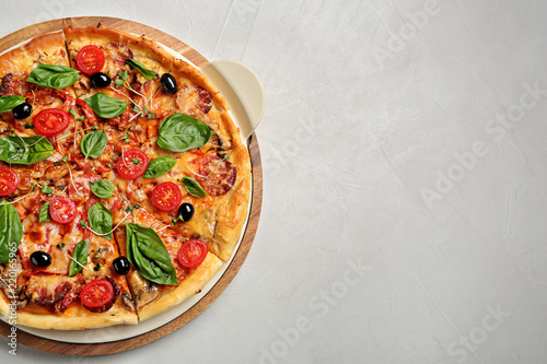 Tasty homemade pizza and space for text on table, top view