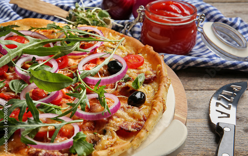 Tasty homemade pizza on wooden table, closeup
