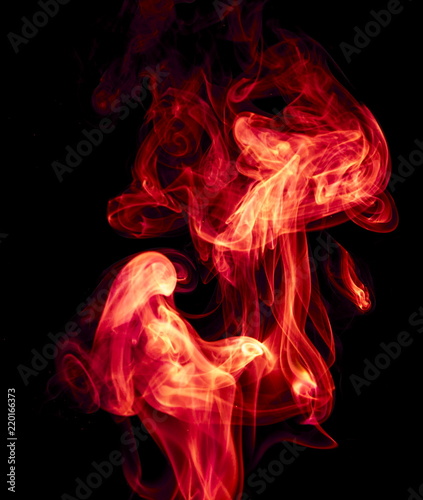 Red smoke on black background