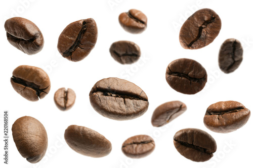 flying coffee beans isolated on white