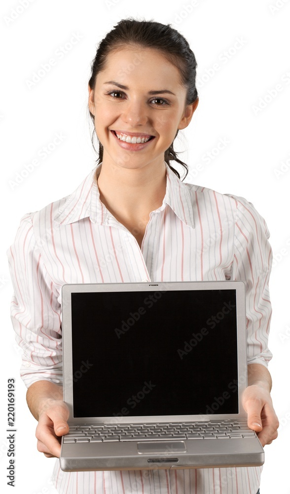 Smiling brunette holding a laptop Smiling brunette holding a laptop