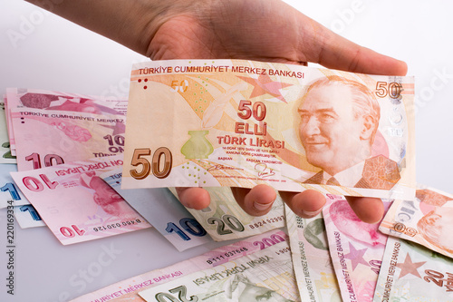 Hand holding Turksh Lira banknote  in hand photo