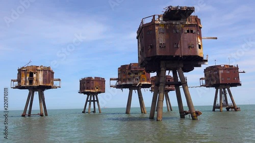 The Maunsell Forts, old World War two structures stand rusting on stilts in the Thames River Estuary in England. photo