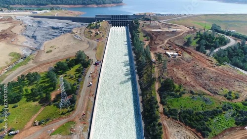 Spectacular aerial of water flowing through the restored new spillway at Oroville Dam, California. photo