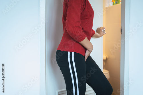 Hands woman holding her crotch,Female need to pee