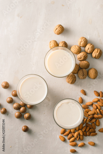 Glasses of milk: Macadamia, almond, walnut. Top view.