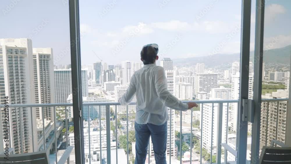 Man playing game in virtual reality glasses in Honolulu in 4k slow motion 60fps Man playing game in virtual reality glasses in Honolulu in 4k slow motion 60fps