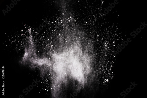 White powder explosion on white background. Colored cloud. Colorful dust explode. Paint Holi.