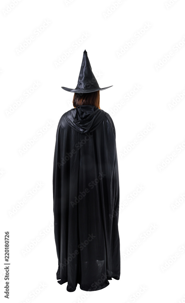Back view  of woman in black Scary witch halloween costume standing with hat isolated on white background