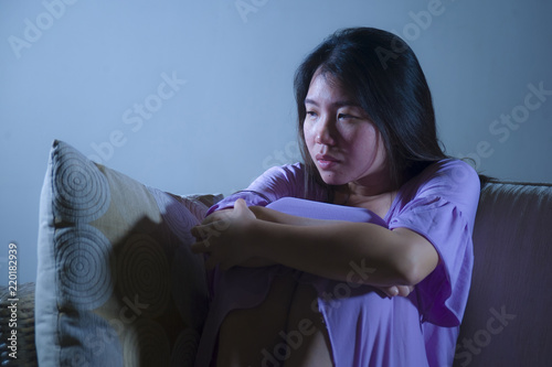 Obraz na plátně young sad and depressed Asian Japanese woman crying alone desperate and worried