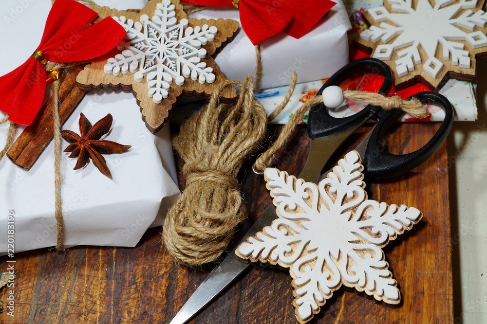 Christmas gifts and decoration on wooden table in retro style packing Christmas gifts
Christmas gifts and decoration on wooden table in retro style packing Christmas gifts