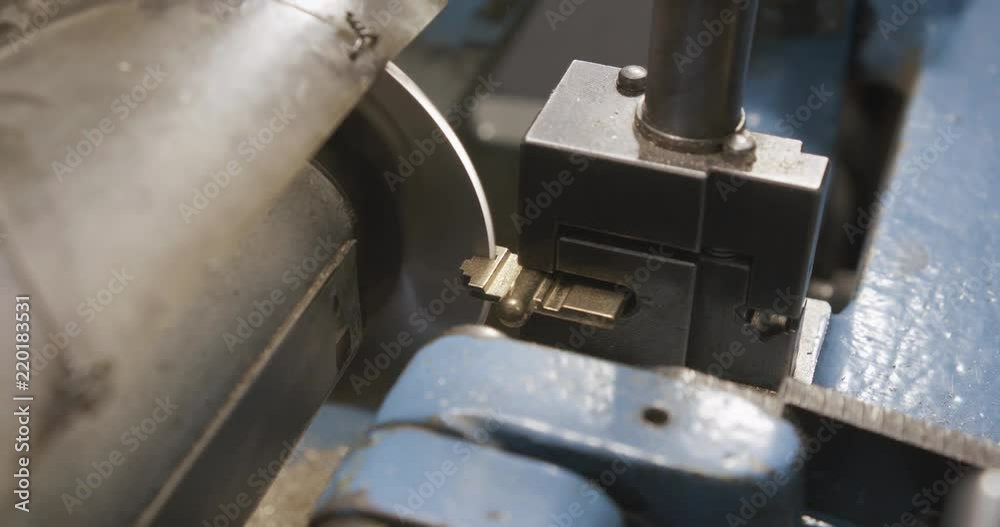 Locksmith makes a duplicate of the key lock. Close up Locksmith makes a duplicate of the key lock. Close up