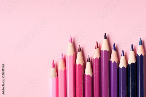 Color pencils isolated on pink background.
