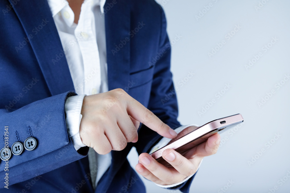 Business man using a smart phone isolated on white background. Business man using a smart phone isolated on white background.