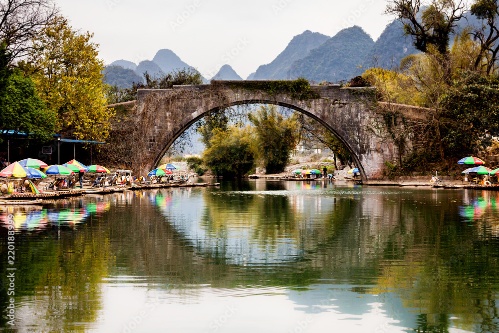 Old bridge on Dragon river in Yangshuo China Old bridge on Dragon river in Yangshuo China