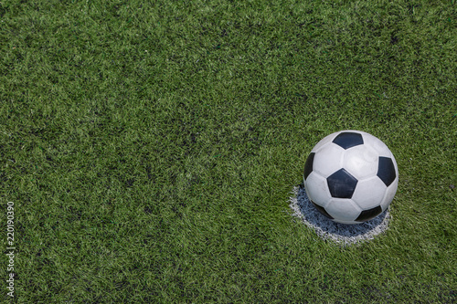 soccer ball on green soccer field grass